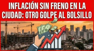 Miniatura con el título en texto blanco sobre fondo rojo: "INFLACIÓN SIN FRENO EN LA CIUDAD: OTRO GOLPE AL BOLSILLO". Debajo, una ilustración muestra una mano sosteniendo una billetera de la que salen billetes volando, junto a un gráfico de barras con una gran flecha roja ascendente. El fondo es un paisaje urbano al atardecer con grúas de construcción borrosas.