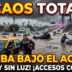 Miniatura de noticias sensacionalista de 'Info del Plata' con un taxi porteño medio sumergido y un hombre desesperado de pie en aguas marrones de una calle inundada del AMBA. De fondo, un gran puente congestionado con coches volcados y sumergidos bajo una lluvia intensa. Texto superpuesto: ¡CAOS TOTAL! AMBA BAJO EL AGUA. ¡160MM Y SIN LUZ! ¡ACCESOS CORTADOS!.
